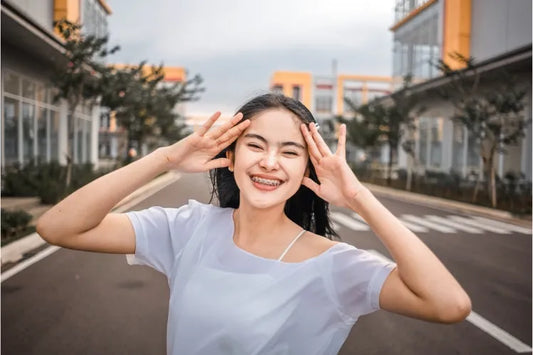A girl is wearing self ligating braces