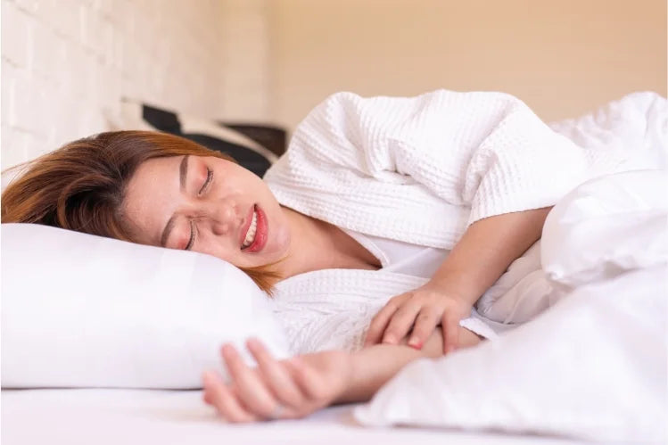 A woman grinding her teeth while sleeping