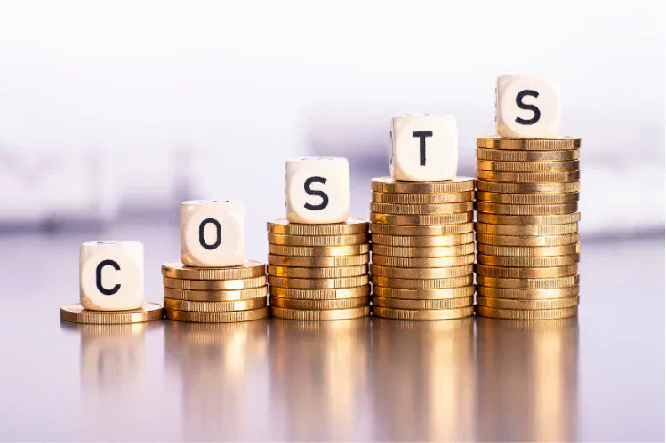 Stacks of coins with alphabet spelling costs