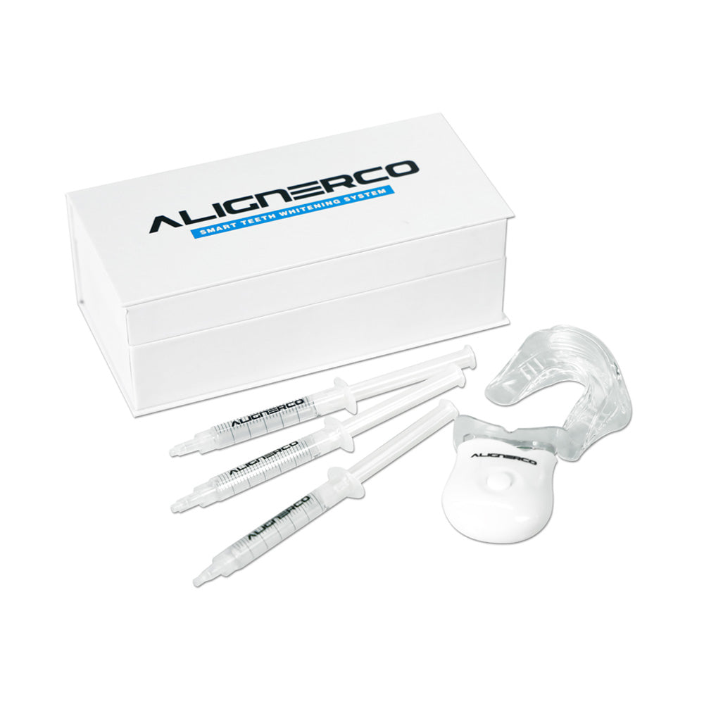 Alignerco teeth whitening kit with LED light, syringes, and mouth tray displayed.