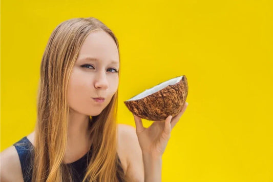 A girl with a coconut in hand