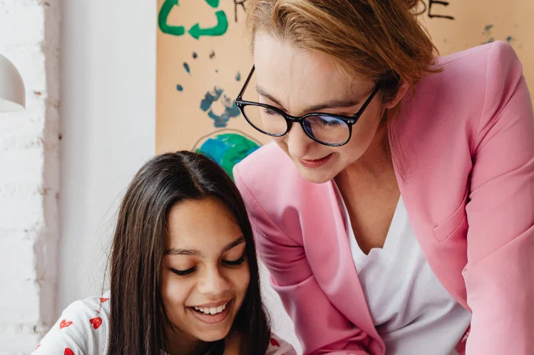 Teacher is teaching a girl