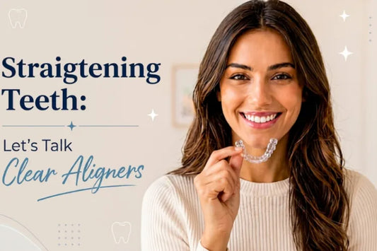  A girl smiling while holding retainers on het hand 