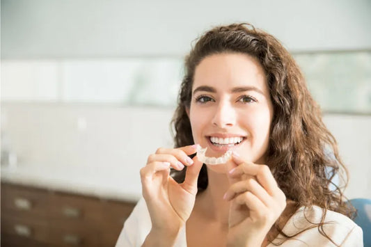 A woman wearing clear retainers