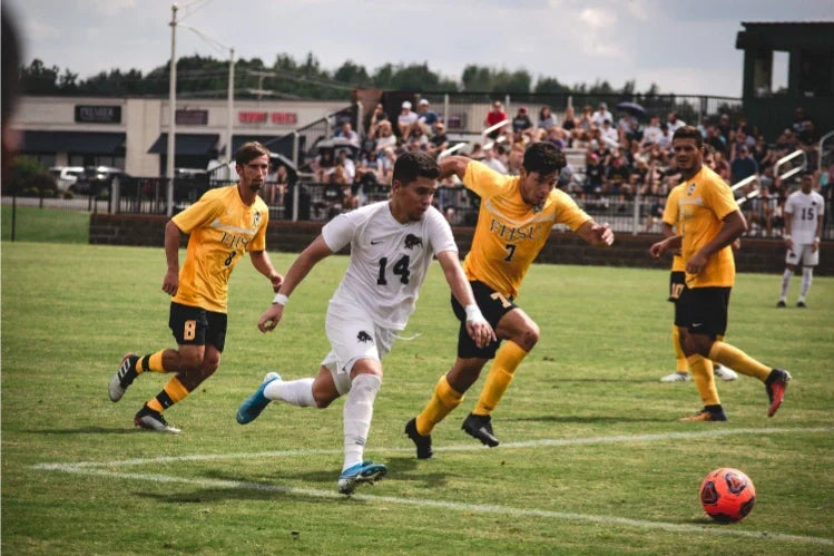 Men playing football outdoors