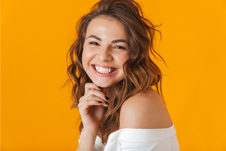 A model with a close-up shot, showing her smile