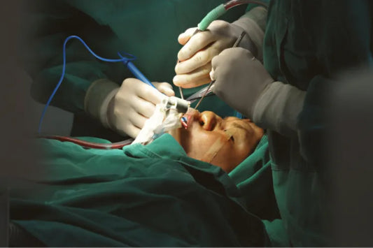 A guy getting  his orthodontic surgery done