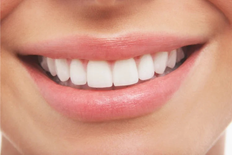 Woman is showing her straightened teeth