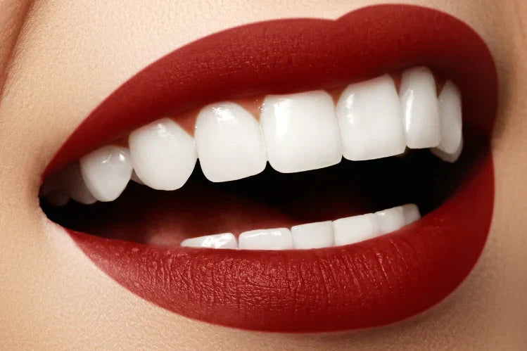  A girl shows her flawless grin while straightening her teeth.