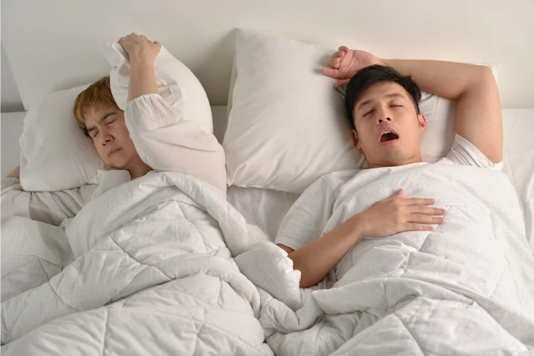 woman is disturbed by her partner's snoring